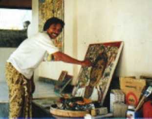 Djirna with one of his paintings